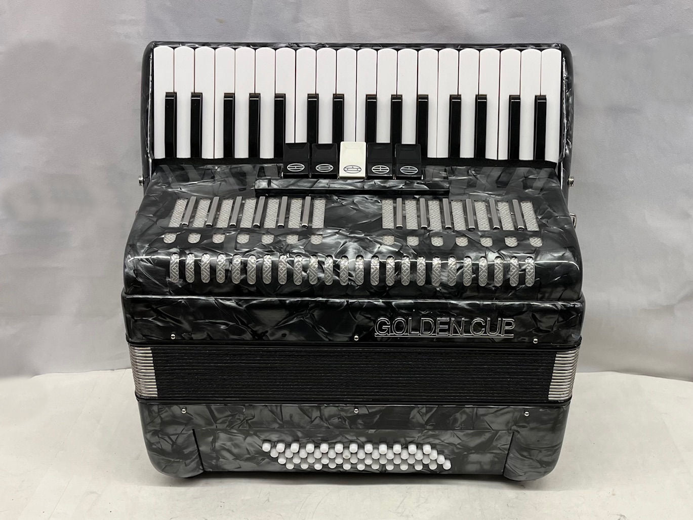 Golden store cup accordion